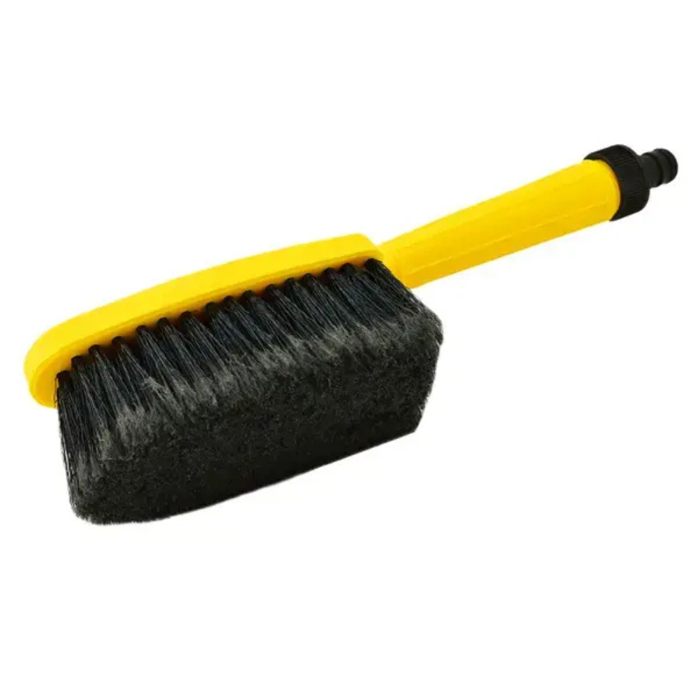 Car wash brush with yellow handle and black bristles on a white background